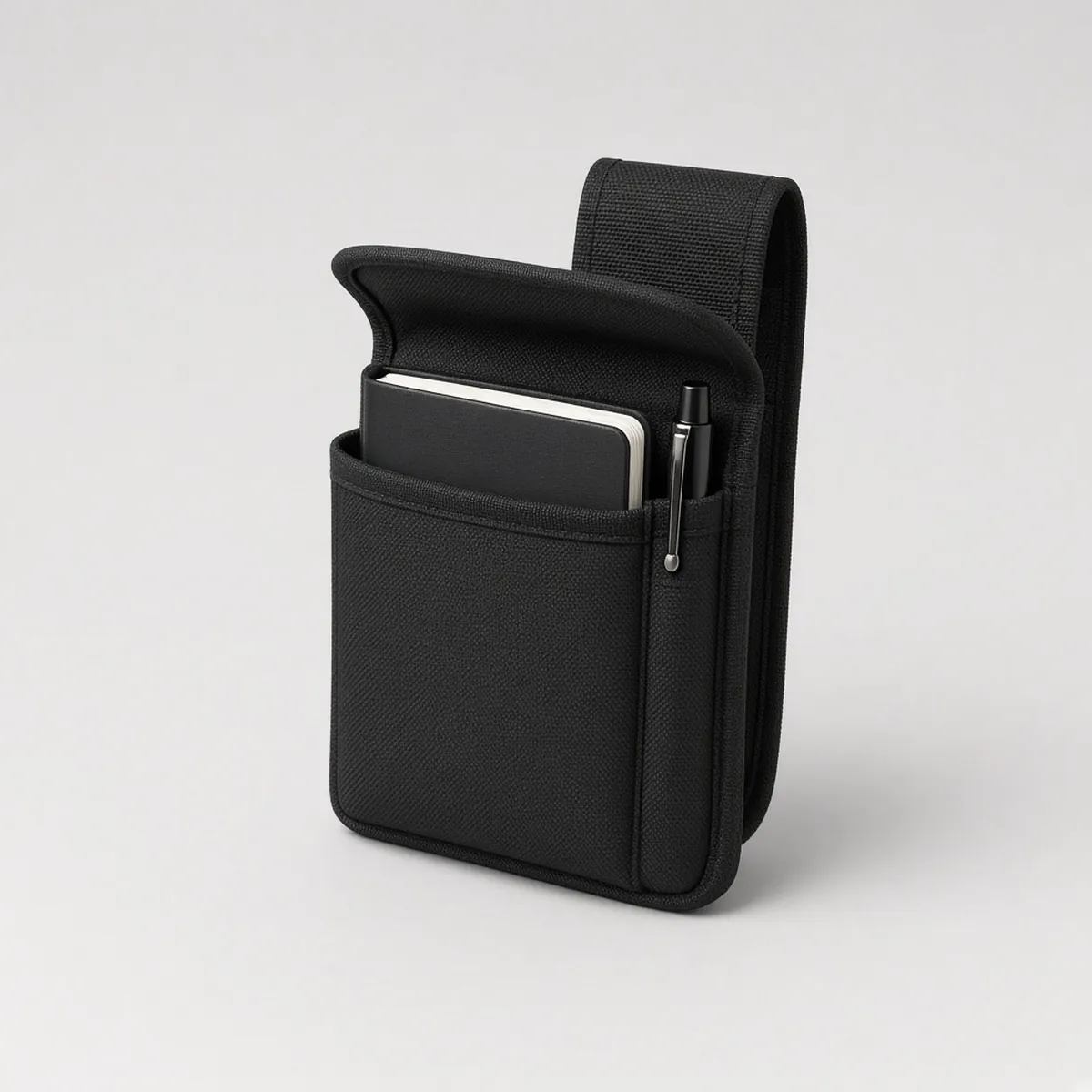 Black duty belt notebook pouch with a notebook and pen tucked in the front pocket